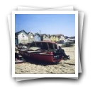 Vista de barcos de pesca e conjunto de casas construídas sobre a praia, Vila do Conde